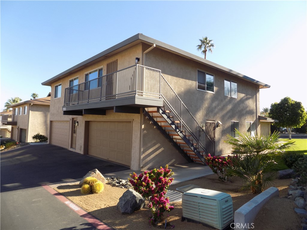 Remodeled 2 bedroom 1 bath upstairs unit. The Private stairs leads to the unit with no one below! Rustique laminate flooring installed in living room, dining room, hallways and bedrooms. Vinyl dual Pane Low-E windows throughout with interior mini-blinds and blackout curtains. The entry has a coat closet and opens to the living room, dining area and kitchen. The kitchen has Espresso colour maple cabinets with Calacatta Quartz counter tops, hanging light fixtures, Frigidaire stainless steel electric stove and an overhead microwave oven with exhaust fan, a Kenmore white refrigerator, brushed nickel faucet and sink, and ceramic tile flooring. The dining room, adjacent to the kitchen, has a ceiling fan and window over looking the court yard. The bathroom has a shower over-tub, a single vanity with brushed nickel faucet, mirror, light fixture and ceramic tile flooring. Both bedrooms have ceiling fans and nice sized closets. The hallway has two large capacity closets. The town-home offers Central Air and Heat. The unit shares a garage for one car. A community laundry room is adjacent to the garage. The community has two pools with spas for your use. The town-home is within a short distance to El Paseo Shopping District includes Shops, Restaurants, Art, Jewelry and more!. Outdoor activity includes the The Living Desert Zoo and Gardens. and hiking trails of Cap Homme and Ralph Adams Park.