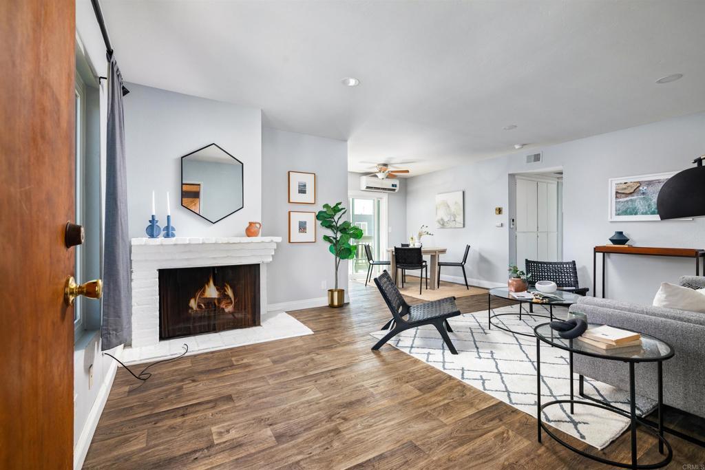 This is one of the only units in the building with brand new AC, new windows, and a new sliding doors. Start your day with coffee on your private balcony in the heart of University Heights. This top floor corner unit offers rare peace and privacy with no one above and windows on three sides bringing in beautiful natural light. The spacious layout features a cozy fireplace, a dining area that opens to your own outdoor retreat, and thoughtful upgrades throughout including new floors, new paint, and new light fixtures. Unlike the other units, this one includes a brand wall AC unit for year round comfort, plus new dual pane windows, a sliding glass door, and screen doors that add comfort, quiet, and energy efficiency. There are two generous bedrooms. One has mirrored closets and the other has a walk in, its own private balcony, and a laundry closet with hookups ready for use. Whether you are a first time buyer looking to personalize your space or an investor focused on long term potential, this one checks all the boxes. A private garage in the alley and an additional parking spot out front provide added convenience. You are just a short stroll from buzzing cafes, neighborhood shops, and the peaceful green space at Trolley Barn Park. This is your chance to own in one of San Diego’s most walkable and loved neighborhoods. Do not miss it.