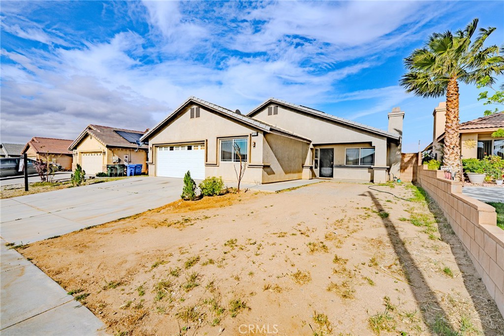 Welcome home! Nestled in a peaceful cul-de-sac in Adelanto, CA, this charming single-story residence invites you in with warmth and comfort—without the hassle of an HOA! Offering 5 spacious bedrooms and 3.5 well-appointed bathrooms, this home features an expansive, open-concept layout ideal for both relaxed family living and entertaining loved ones.
From the moment you step inside, you'll be captivated by the soaring vaulted ceilings and abundant natural light that fills each room, creating a bright and welcoming atmosphere. At the heart of this home is a beautifully designed kitchen, complete with rich wood cabinetry, elegant granite countertops, stainless steel appliances, and a large center island perfect for gathering around. The adjacent dining area flows effortlessly into a cozy living room, accented by a charming fireplace—ideal for creating lasting memories on cool evenings.
