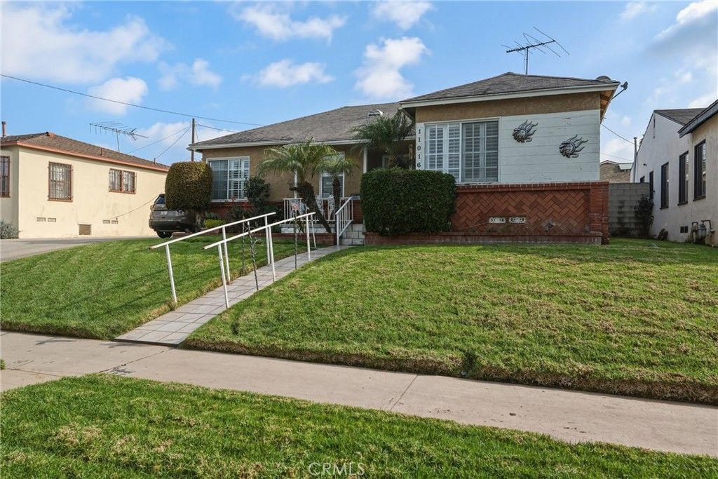 Photo of 11016 S, VAN NESS Ave, Los Angeles, CA 90047 (MLS # SB26013050)