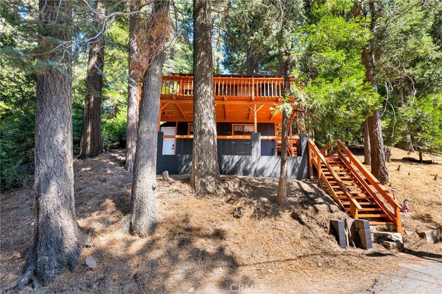 Adorable 2 bedroom, 2 bathroom cabin near the lake and close to town! This well maintain cabin features a freshly painted exterior and is move in ready. Perfect to make it your own. Included in the sale is the adjoining land next to it on the right side, giving you extra space to enjoy. Don't miss this charming cabin retreat!