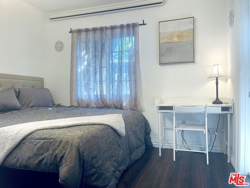 This beautifully appointed unit offers comfort, privacy, and convenience in one of Los Angeles' most desirable neighborhoods. The residence features hardwood floors, generous closet space with built-in shelving, a private entrance through elegant French double doors, and abundant natural light streaming through multiple windows that invite fresh air and sunshine. Enjoy access to a charming patio and garden area complete with outdoor seating, perfect for relaxing. The room is offered furnished, including a mini fridge, microwave, and coffeemaker for your convenience. Ideally located just steps from shops, grocery stores, restaurants and theaters. This home offers excellent walkability, easy access to UCLA, Beverly Hills, Santa Monica, major freeways, public transit and much more. RENT INCLUDES: Power, water, trash, gardener, internet, and street permit parking.