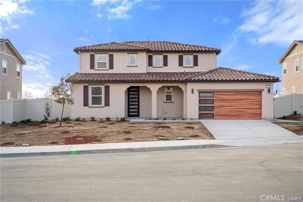 Welcome to Luxury Living at 14417 Buvan Court, Moreno Valley, CA 92555. Discover this newly constructed luxury home nestled in a cul-de-sac, designed for both elegance and functionality. ***PAID-OFF SOLAR PANELS*** make this home energy-efficient and cost-effective. As you step inside, you'll immediately notice the open floor plan bathed in natural light, creating a warm and inviting atmosphere. The spacious living room features a cozy fireplace, seamlessly flowing into the dining area and a chef-inspired European-style kitchen—perfect for entertaining. A convenient half-bath is also available for guests. This home boasts beautiful wood flooring throughout and elegant tile in wet areas. A standout feature is the attached 2-bedroom, 1-bath ADU with its own private entrance, ideal for rental income or accommodating family members. Upstairs, sleek glass railings lead you to three additional bedrooms, including a primary suite with a spacious walk-in closet, built-in shelving, and a custom-designed European-style bathroom featuring a luxurious walk-in shower. A dedicated laundry room adds to the home's convenience. Step outside to a versatile backyard, perfect for relaxation, entertaining guests, or hosting barbecues. You’ll have the opportunity to customize the landscaping to suit your style. The home also includes a custom-designed two-car garage. Situated in a highly desirable community, this property offers easy access to shopping centers, restaurants, and Freeway 60. This isn’t just a home—it’s THE home.