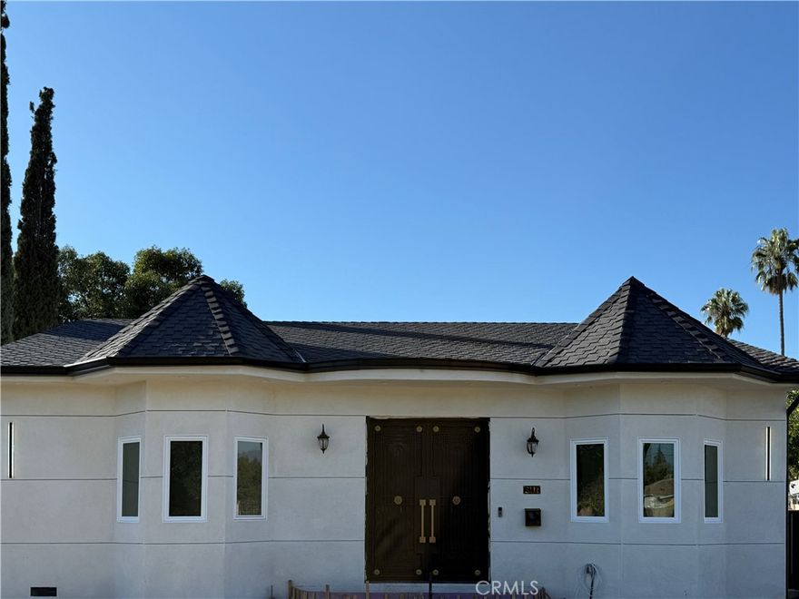 Experience modern luxury in this stunning North Hollywood property featuring a fully remodeled main residence with permitted additions and a newly built ADU. The main home offers approximately 1,995 sq. ft. of refined living space with 4 bedrooms and 3 bathrooms, highlighted by 10 feet high ceilings, an open floor plan, and a striking metallic double-door entry. The open kitchen showcases a sleek modern design with a center island, premium finishes, and new appliances throughout. The spacious living room is anchored by an elegant electric fireplace, creating the perfect atmosphere for relaxation and entertaining.

The newly constructed ADU offers approximately 825 sq. ft. with 2 bedrooms, 2 bathrooms, indoor laundry, a full modern kitchen, and its own comfortable living area—ideal for extended family, guests, or rental income. Situated on a desirable corner lot, the ADU features a separate address and private side-street access. Thoughtfully designed with privacy in mind, the ADU has no windows or doors facing the main house's backyard, ensuring complete separation between both living spaces.

Both units offer high ceilings, contemporary finishes, and meticulous craftsmanship. A rare turnkey opportunity delivering comfort, versatility, and upscale living in one of North Hollywood’s most sought-after neighborhoods.