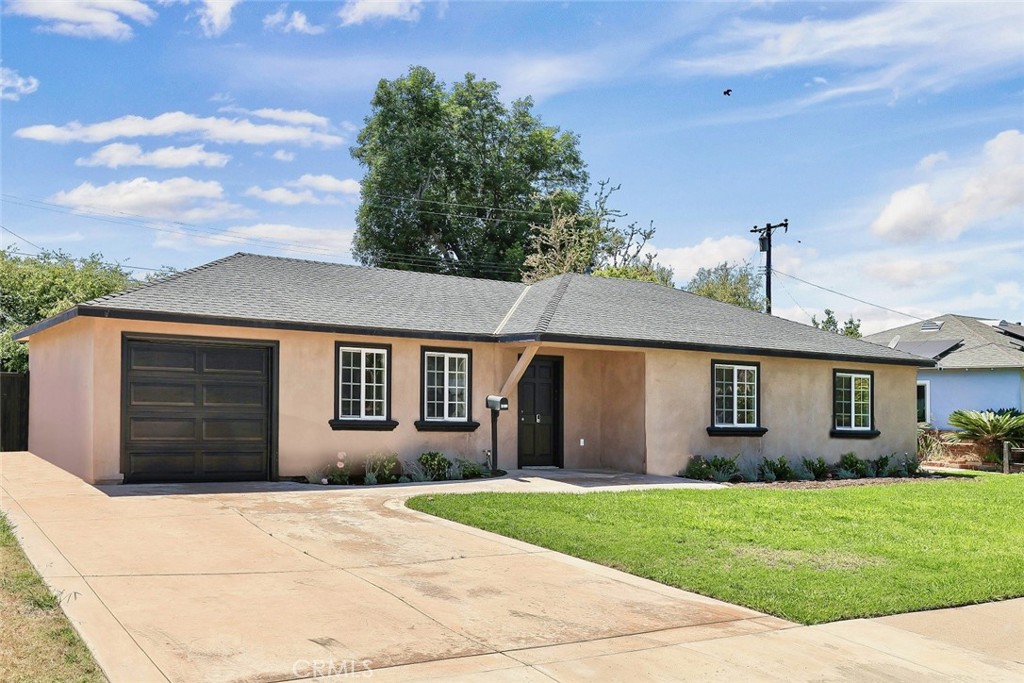 Located in the sought-after Westminster neighborhood of Indian Village, this 1,237± sq. ft. single-story home—built in 1955—combines timeless character with modern updates and a flexible floor plan. Featuring 3 spacious bedrooms, the well-designed layout was originally a 4-bedroom home, with one bedroom opened to create a versatile den. This space works perfectly as a home office, playroom, formal dining room, or sitting area and can easily be converted back to a fourth bedroom if desired.
The exterior showcases a classic stucco finish with crisp black trim, enhanced by a stamped, colored concrete driveway and front walkway. The wide driveway, attached garage, and covered front porch add to the curb appeal. Inside, abundant natural light from dual-pane windows, a neutral palette, and ceiling fans in nearly every room create a bright, airy atmosphere. The main living areas feature ez-care laminate wood flooring, while the bedrooms are finished with new plush carpeting.
At the heart of the home is a charming country-style kitchen with granite countertops, extensive rustic-finish cabinetry, recessed lighting, and a full suite of black appliances including a gas range, built-in microwave, refrigerator, and dishwasher. The kitchen offers direct access to the large concrete patio—perfect for weekend barbecues and dining alfresco. The backyard is a private retreat with mature shade trees, block wall fencing, perimeter planters, and a spacious lawn—ideal for gardening, play, or entertaining.
Close to schools, parks, shopping, dining, and freeway access, this home blends comfort, convenience, and adaptability. With its move-in ready condition, functional floor plan, and option to convert back to four bedrooms, this classic home offers flexibility to meet your lifestyle needs.