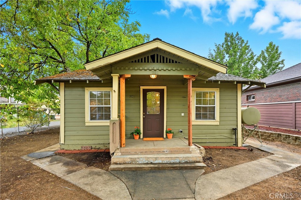 Charming Vintage Bungalow in Prime Lakeport Location. Discover this adorable 1 bed/1 bath home (+ bonus room), ideally situated on the corner of 11th & Manzanita. Bursting with potential, this property offers versatile use, perfect for a cozy residence or professional office space. Inside, the kitchen features quartz countertops and plenty of prep space, while the all-electric home provides easy living. Upgrades include a mini split in the living room and luxury vinyl plank flooring throughout excluding the bedroom offering brand new carpet. The spacious corner lot has side road access for added safety and is ideal for the avid gardener. There is a detached 2-car garage with a dedicated laundry room and extra space inside for a workshop. Additionally, this property offers ample parking options on the street, drive-way, direct garage access and room for parking your boat or RV! Enjoy the unbeatable convenience of being moments from shopping, dining, and all downtown Lakeport amenities. Schedule your tour today or 701 11th Street!