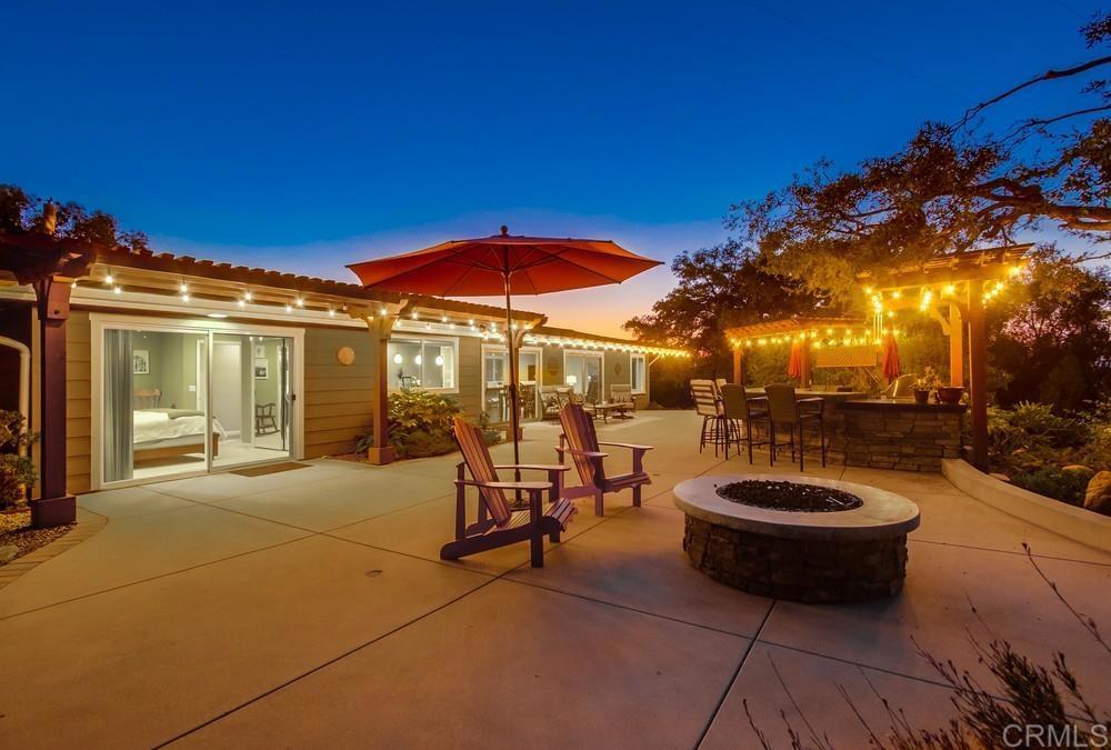Views, views, views. Full remodel completed in 2019. Oversized primary suite with its own entrance and patio. Paved RV parking with electricity. Two- 2 car garages - one attached, one detached. Paid solar covers the electric bill!. New roof. New dual HVAC systems. New double-pane windows. New cement siding. Hardwood floors. Entertainers' patio. Mature oak trees. New driveway and landscaping. Large storage shed. Quiet cul-de-sac. Peaceful neighborhood. Must see to appreciate!