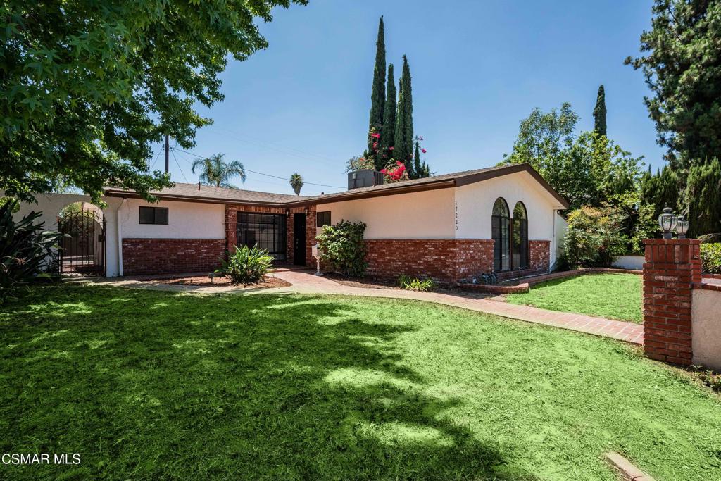 Great opportunity in the heart of Granada Hills. This single-story home offers a functional layout, a private backyard with a pool, and a detached two-car garage with separate alley access. The large front yard offers potential to be fenced in for added privacy and outdoor enjoyment. Inside, the home has been tastefully upgraded with luxury laminate flooring, recessed lighting, smooth ceilings, and thick crown and baseboards throughout. The newly remodeled kitchen features white cabinetry, black quartz countertops, and stainless steel appliances, offering a clean and modern look. The family room is warm and inviting, anchored by a charming floor-to-ceiling white brick fireplace and oversized sliding glass doors that open to the backyard. The bedrooms are filled with natural light, including a primary suite with mirrored closet doors and an en-suite bath that features a new vanity, open shelving, and a stand-up shower. The guest bedrooms also include recessed lighting and mirrored closet doors, while the updated hall bath offers granite counters, a rich wood vanity, and a shower/tub combination. This home features a well-thought-out floor-plan, with the primary bedroom separated from the guest bedrooms. Throughout the home, open archways add a touch of character and visual appeal. The backyard is ideal for entertaining, complete with a swimming pool and covered patio space. With its convenient Granada Hills location, functional layout, and valuable upgrades, this is a fantastic opportunity to own a well-maintained home.
