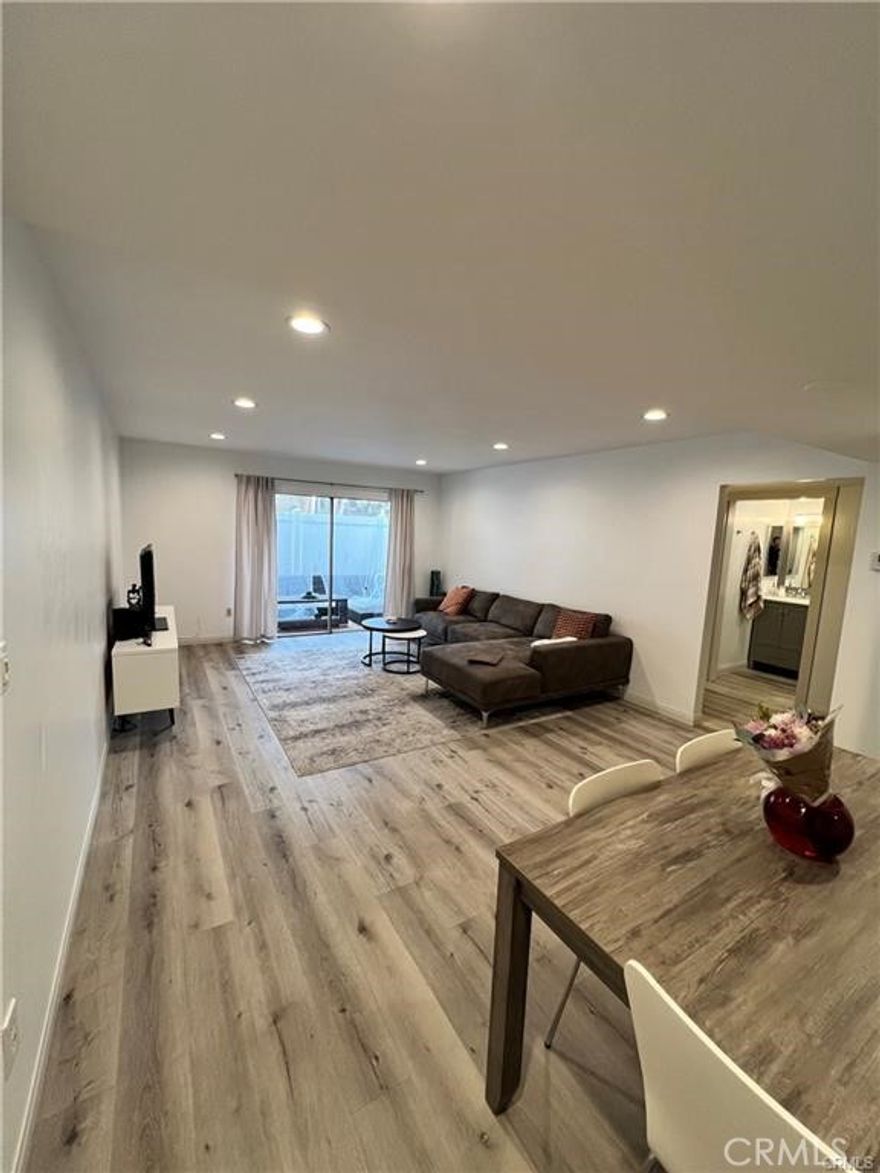 Welcome to your luxurious retreat! Available for showings starting August 8th. This fully renovated 3-bed, 2-bath condo in the sought-after Village Northridge community in Porter Ranch Enjoy the convenience of a main-level unit with stunning views and an unbeatable location within the development. Step inside to discover an open concept floorplan adorned with wood vinyl flooring, creating a warm and inviting atmosphere. Features an in-unit washer and dryer. The kitchen is a chef's delight, boasting newly updated granite countertops, and stylish shaker-style cabinets, perfect for preparing delicious meals. Relax in the spacious primary bedroom suite featuring dual closets and a luxurious ensuite full bath, offering privacy and tranquility. The generously sized 2nd and 3rd bedrooms are adjacent to another full bath, providing ample space for family or guests. Entertain in style on your gorgeous private patio, flooded with natural light and offering plenty of space for gatherings. Additional highlights include gated entry, two side-by-side parking spots. Indulge in the community's wonderful amenities, including a pool, spa, and gym areas, all included in the rent along with gas, water, sewer, and scavenger services. Centrally located and just moments away from CSUN, Granada Hills Charter, and other award-winning schools, this condo offers the perfect blend of luxury and convenience. Don't miss out on this incredible opportunity to experience resort-style living in the heart of Porter Ranch!