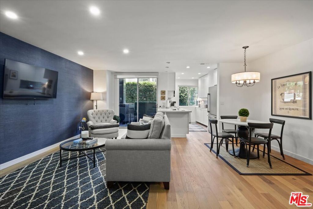 Chic Hollywood HideawayDiscover your perfect LA retreat in this stylish and spacious 1-bedroom, 1-bathroom condo located at the foot of iconic Runyon Canyon. Situated in the coveted Hollywood Hills-adjacent Franklin Towers, Unit #101 offers a rare blend of modern comfort, privacy, and prime city access.This light-filled corner unit features an open floor plan with wood laminate floors, updated finishes, and oversized windows that invite in natural light. The contemporary kitchen is outfitted with quartz counters, shaker cabinets, modern appliances and ample storageideal for both everyday living and entertaining.The generously sized bedroom offers peaceful separation and includes a large closet, while the bathroom features modern fixtures and a clean, spa-like vibe. Step outside to your private patio, a perfect spot for morning coffee or evening relaxation. The in-unit washer and dryer adds everyday convenience,Building amenities include a resort-style roof top with 360 degree views of Los Angeles and Hollywood Hills deck, pool, fitness center, secured entry, and gated parking. Just minutes from Runyon hiking trails, the Sunset Strip, and Hollywood's hottest dining and entertainmentthis is your chance to live the Hollywood lifestyle with ease and style.