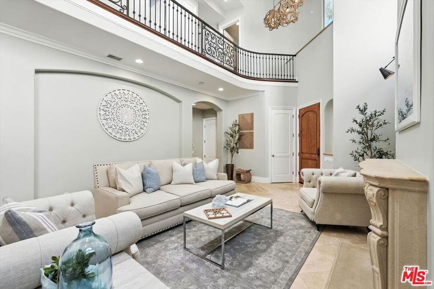 Discover Mediterranean elegance nestled right on the Greenbelt in Manhattan Beach's serene Tree Section. Welcome to this beautifully appointed 5-bedroom, 5-bath home designed by the award-winning Trotter Building Designs Inc.  A progressive building design firm based in Manhattan Beach.  Built in 2004 and offering over 3,109 sq ft of thoughtfully curated living space on a 4,764 sq ft lot.  From the moment you enter, enjoy the breathtaking openness of vaulted ceilings and thoughtful custom artistry that combine to create an open, high-end ambience. Sunlit interiors create a spacious and inviting atmosphere.  A warm smooth finish stucco facade, red-tile roof, and lush front yard set the tone before you even step inside. Inside, formal and informal gathering spaces abound: An elegant front living room with fireplace, and an open-concept, cozy rear family room with fireplace balanced by a large kitchen on the opposing side. Upstairs, a handy laundry room promotes both comfort and functionality. Main floor has a front bedroom/office with bathroom ensuite for guest quarters and an addition guest bathroom.  The remainder 4 bedrooms are upstairs, including a charming primary suite with its own fireplace and east-facing balcony, ensuring restful retreats for all. Upstairs front bedroom ensuite (Jack & Jill full bathroom) has a west facing balcony offering open treetop views and endless skies.  Smart NEST controlled HVAC (Wi-Fi enabled) thermostat. A generously sized rear patio with Lynx barbecue, built-in beer taps, and outdoor fireplace, set within serene, landscaped surroundings. A two-car-attached garage, and a location that blends tranquility with convenience, this home combines refined style with everyday ease. Situated directly on the greenbelt, this home offers effortless access to peaceful green open spaces, the vibrant downtown, and the beach making it an ideal South Bay haven. Such a charming street with a walker's paradise score of 85, making it easy to explore the nearby world-class restaurants at the Manhattan Village shopping center. Minutes to sandy beaches. You are also surrounded by highly rated schools, such as Mira Costa High School, and Manhattan Beach Elementary School. A testament to its enduring appeal and prime setting. Don't miss this exceptional opportunity to own in one of Manhattan Beach's most cherished pockets.