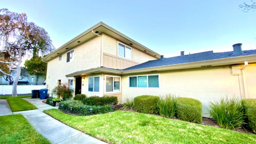 This beautifully updated townhouse-style 2-story condo has hardwood floors throughout, recessed lighting, fresh paint, newer stainless steel appliances, newer washer and dryer. Walk-in closet in master bedroom. Convenient location, walking distance to BART, shopping center, grocery stores, restaurants, banks and Top Rated Schools. Easy Access to 880. The attached carport parking has extra storage.