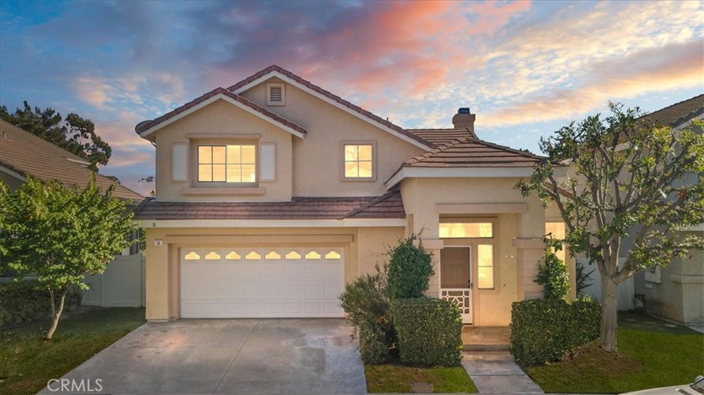 First Time on the Market in 30 Years! Charming 3-Bedroom Home on peaceful Cul-de-Sac in Foothill Ranch, a wonderfully maintained 3-bedroom, 2.5-bath, 1,624 sq. ft. home. Nestled in the highly desirable community of Foothill Ranch (Lake Forest), this move-in-ready two-story home offers a perfect blend of comfort, charm, and potential. Step inside to a classic floor plan featuring vaulted ceilings, abundant natural light, and a seamless flow between living spaces. The living room welcomes you with laminate flooring (installed 2018) and soaring ceilings, while the adjacent family room features brand-new carpet and a cozy tile-surround gas fireplace—perfect for relaxing or entertaining. Large windows offer unobstructed panoramic views of the rolling hills, which can also be enjoyed from most rooms in the home. The kitchen includes durable tile countertops, ample storage, and a garden-view dining area ideal for casual meals or hosting friends. Upstairs, you’ll find all three bedrooms, including an expansive primary suite with vaulted ceilings, dual sinks, a large soaking tub, separate shower, and private water closet. Two of the bedrooms have brand-new carpet, while the third has beautiful, newer laminate flooring. Additional upgrades include: Fresh interior paint throughout. New carpet in family room, stairs, upstairs hallway, and two bedrooms. Newer water heater (2024). HVAC system (2014). Newer washer and dryer (purchased less than a year ago). Double privacy gates to side yard—great for pets or storage. Covered back patio with ceiling fan and light—ideal for outdoor dining or lounging. Attached 2-car garage and full driveway. Enjoy a spacious and private backyard with a lemon tree, low-maintenance landscaping, and peaceful hillside views—an ideal setting for relaxing evenings or weekend gatherings. Located minutes from top-rated schools, scenic hiking and biking trails, Foothill Ranch Community Park, a library, shopping, dining, and the community pool, spa, and clubhouse. Plus, you’ll enjoy quick access to major freeways and Toll Roads. This home offers the perfect opportunity to settle into one of South Orange County’s most beloved neighborhoods—don’t miss your chance to make it your own!