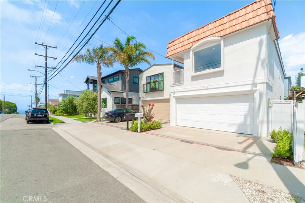 Sophisticated coastal retreat just minutes from the sand. This 3-bed, 2-bath home features light-filled living spaces, hardwood floors, and a chef’s kitchen with granite counters and stainless steel appliances. The upstairs hosts an elegant primary suite and open areas, while the first floor offers two bedrooms and a full bath. A private patio is perfect for entertaining. Close to The Strand, Pier Plaza, dining, shops, and beach volleyball—Hermosa living at its finest.