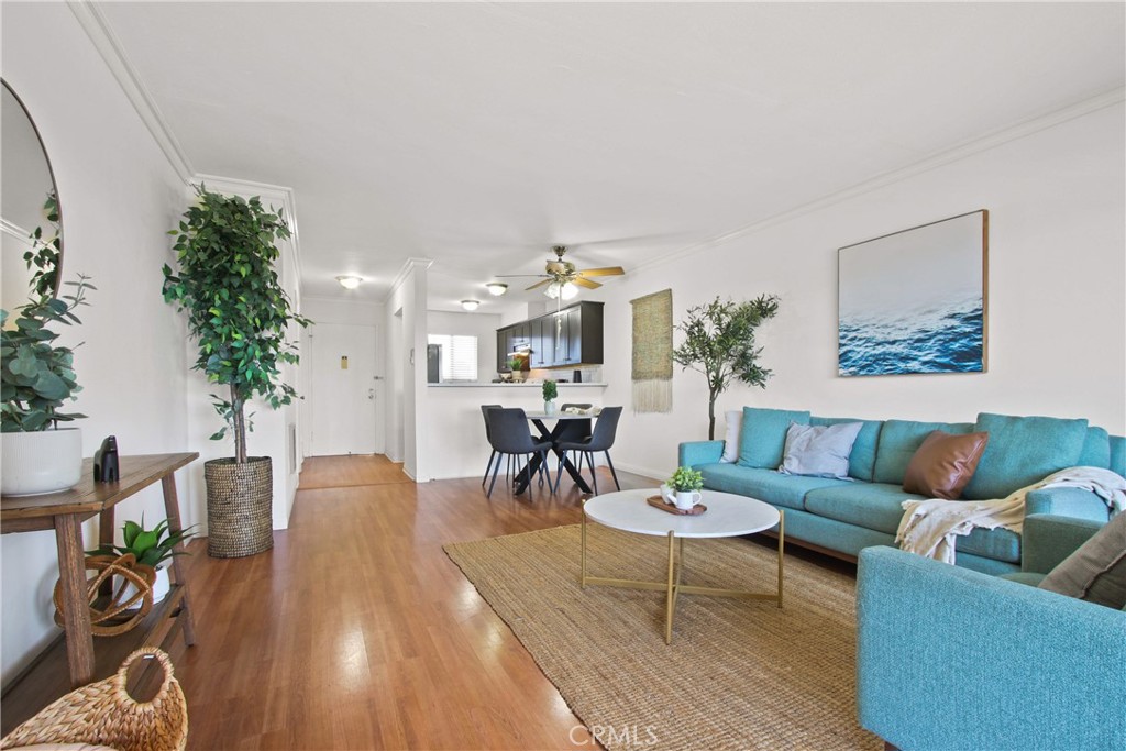 Lakeview Terrace condo directly across from Ken Malloy Harbor Regional Park. Move-in ready with newer laminate wood flooring and an open-concept kitchen that flows into the living area—ideal for entertaining. Private deck overlooks the pool and park for a beautiful and relaxing view. Spacious 2 bed / 1 bath layout is well-maintained, Unit is conveniently located near the pool and jacuzzi. Central location with quick access to major freeways, hospital, and shopping. Extra-deep 2-car garage on the ground level offers plenty of room for storage. Perfect opportunity for first-time buyers or small families. Appliances included - refrigerator, microwave, washer and dryer.