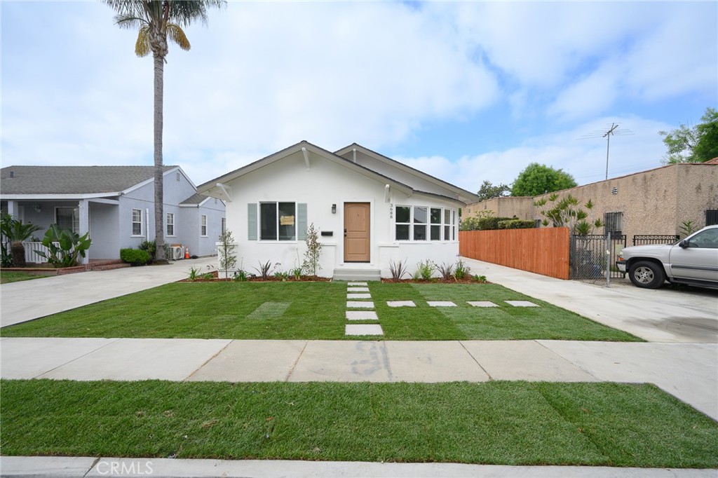 Beautifully UPDATED 3 bedroom, 1 bath home in the heart of Lynwood with ADU possibilities. The kitchen has new custom two tone cabinets, new counter tops, tile backsplash, all new stylish fixtures and stainless steel appliances. The bathroom has new double sink vanity, custom tile work and new fixtures. Other upgrades include luxury flooring, freshly painted interior and exterior, new plumbing and lighting fixtures, ceiling fans in the living room and all bedrooms, new energy efficient windows, upgraded electrical panel, central heat and air conditioning and indoor laundry. This home features a newly landscaped front yard and private enclosed back yard perfect for fun and entertainment. There is one car detached garage and driveway offering off street parking. Conveniently located to schools, freeways, shopping centers, and parks. Tax rolls show different bed count. Buyer to verify all building codes and ADU guidelines with the city.