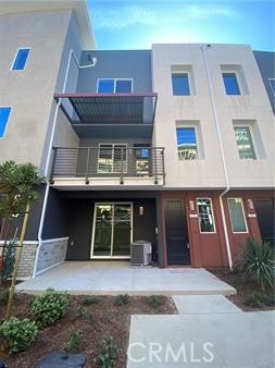 Stylish 3-story townhome offers 3 bedrooms, 2.5 bathrooms, and a flexible first-floor bonus room ideal as an office or guest bedroom. The second floor features a bright, open concept living area, a spacious kitchen with a large central island, and a walk-in pantry. A guest bathroom adds convenience. All 3 bedrooms are on the third floor, with the master suite featuring a walk-in closet. The inside laundry closet with stacked washer and dryer. covered patio and 2 attached car garage with direct access. Enjoy the swimming pool and spa, green belt with BBQ area, bocce ball court, picnic area. Walking distance to Damond Jamboree Plaza. Enjoy 85-degree Bakery, Haidilao Hot Pot, H-mart, and Walmart. A 3-minute drive brings you to The District with Costco, Whole Foods, Target, and AMC theaters. Commuters will appreciate the 3-minute access to the 405 freeway and 10-minute drive to UC Irvine, with John Wayne Airport, South Coast Plaza, and Hwy 55 nearby. This resort-style townhome blends comfort and convenience, making it an ideal home.