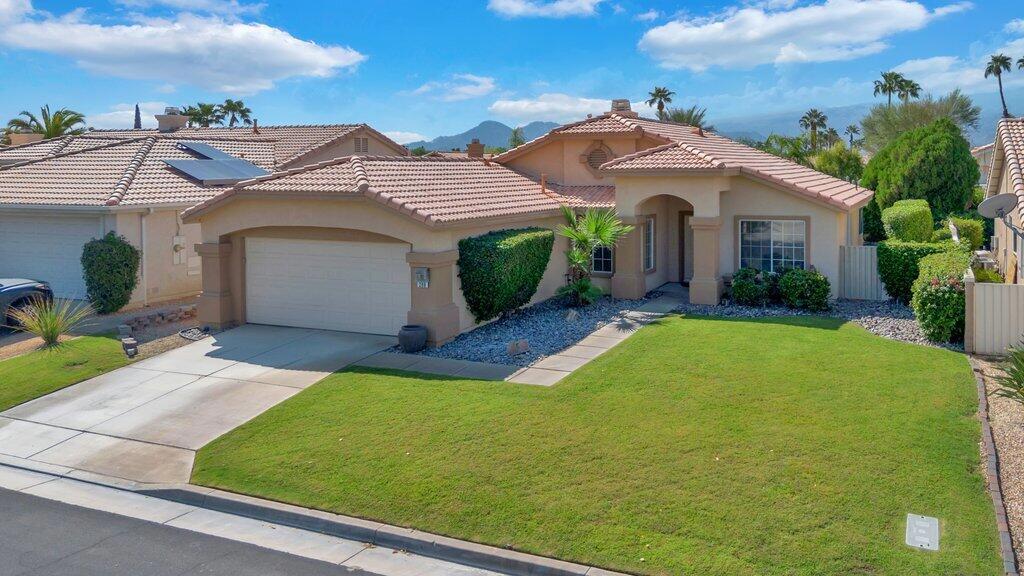 This property is located within the highly desirable gated community of Merano. This home has been very well maintained by the present owners and upgraded and remodeled. The many upgrades include a remodeled kitchen with upgraded cabinetry, granite counters and stainless-steel appliances. The kitchen leads out to the rear yard patio and spa area for entertaining and enjoyment of the wonderful mountain views to the west. The home has also been upgraded throughout with beautiful large tile floors with high grade carpeting. The Guest bath and Primary bath have been also upgraded with granite counter tops, cabinets and vessel sinks. The Primary bedroom has a large walk-in closet with more than enough room for clothes and storage. The Primary bedroom also has a glass slider door that leads out to the rear yard entertainment area. The home has three bedrooms, and one is being used as a den or can be used as an office. This charming home is located in the heart of Palm Desert convenient to stores, restaurants and medical offices. To show is to sell