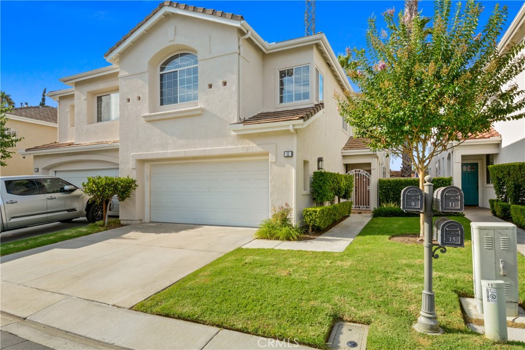Stunning 4-bedroom, 3-bathroom home in the prestigious gated community of Eagle Pointe. This beautifully upgraded residence is the largest model in the tract, offering a perfect blend of luxury and functionality. The main floor features a convenient bedroom and full bath, ideal for guests or multigenerational living, while the large upstairs loft provides flexibility for an office or bonus space. Step inside to soaring cathedral ceilings and an open-concept living and family room, connected by a charming dual-sided fireplace. The gourmet kitchen boasts granite countertops, abundant cabinetry, and stainless steel appliances, perfect for culinary enthusiasts. Designer floor tiles and laminate wood flooring flow throughout, complemented by granite countertops and a luxurious master suite with private and scenic views. The secluded backyard is an entertainer’s dream, tastefully designed for seamless indoor-outdoor living. Enjoy access to the Eagle Pointe community’s pool and spa within a gated setting along with multiple nearby community parks and walking trails. Located near award-winning schools, shopping, dining, major freeways, 73 toll road, and beautiful beaches, this home offers both convenience and tranquility. Don’t miss this opportunity - Schedule a viewing today!