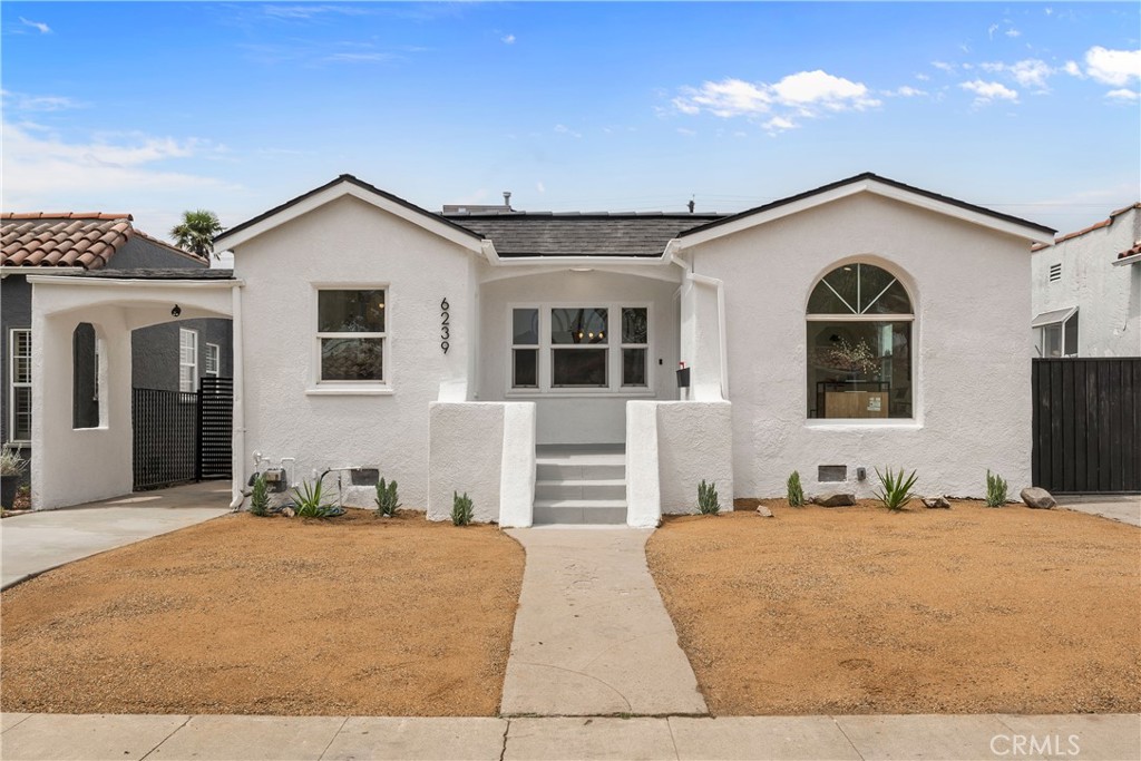Welcome to this beautifully renovated single-story, Spanish-style home, where modern design meets luxurious comfort. Located in a highly desirable neighborhood in Los Angeles, CA. This stunning property boasts a spacious open floor plan with three generously sized bedrooms and various premium features that elevate your living experience. Two full bathrooms have been tastefully renovated with modern mid-century touches. Step inside through a chic front door and be greeted by the inviting ambiance, enhanced by recessed lighting, new white interior paint, and premium laminate wood flooring throughout the home. The heart of this home is the chef-inspired kitchen, complete with gleaming quartz countertops, all-new stainless steel appliances, shaker-style slow-close cabinetry, and a custom peninsula with a waterfall finish perfect for both cooking and entertaining. There is a warm and inviting family room, which features a beautiful wood-burning fireplace, providing a perfect setting for relaxing. This home offers a detached garage that has been cleanly finished with drywall and paint, providing ample storage or to use as a gym/entertainment space. Enjoy the private and cozy backyard to host all of your special gatherings. With its thoughtful design, premium finishes, and a fantastic layout, this home is the perfect blend of modern living and comfort. Great location with all the amenities that Los Angeles has to offer, don't miss this chance to make this property your DREAM HOME!