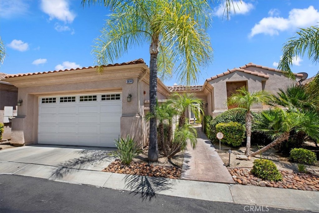 VICTORIA WOODS- PARADISE PALMS- Exclusive gate guarded enclave of just 14 single family detached residences! Main house consisting of 2 bedrooms, 2.5 baths, Massive great room and dining room with 12 foot ceilings; Impressive open concept island kitchen with separate breakfast nook; Luxuriously wide hallways. Separate office/work room off the laundry. Attached guest house bedroom and bath for a total of 3 bedrooms 3 1/2 baths. Private gated front courtyard; expansive covered front and rear patios; over-sized garage. Loaded with upgrades including tile flooring, fresh carpeting, artisitic built in bar and custom built-ins throughout to name just a few. Ideally located close to Victoria Club and a short drive from Downtown and all major shopping areas. Rarely available offering in this unique near 55+community.