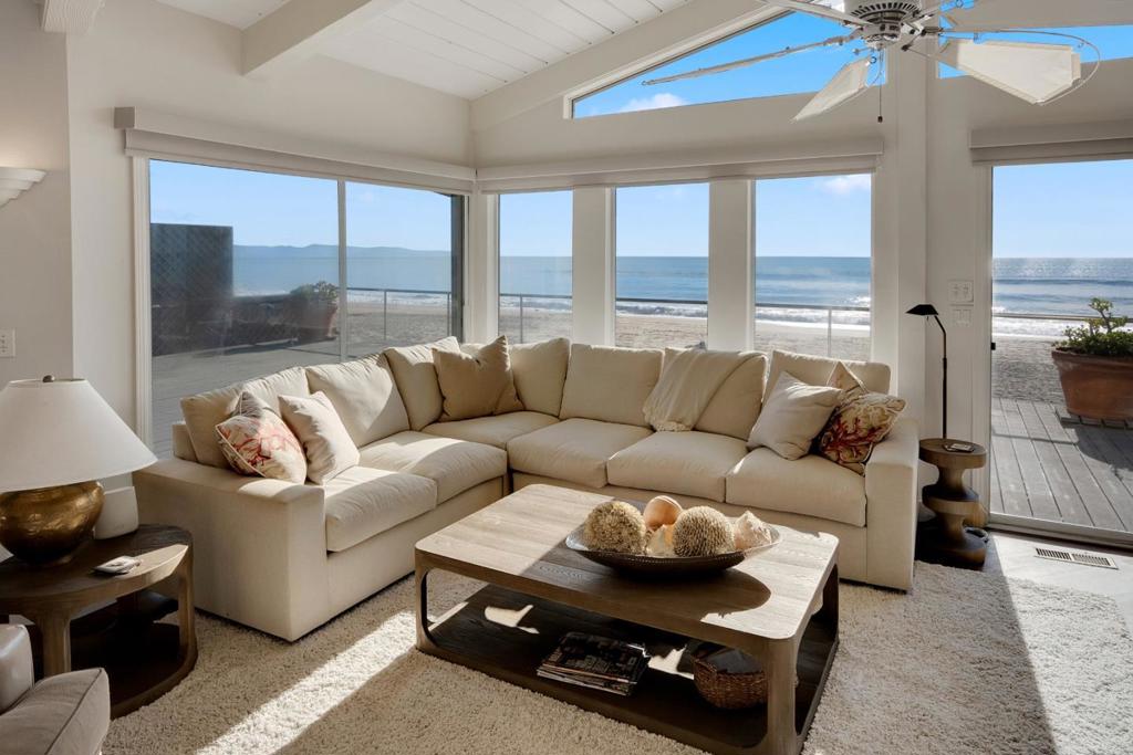 Once in a lifetime opportunity to buy this stunning beachfront home inside the Beach Drive gates. It features panoramic Monterey Bay views from Pebble Beach to Santa Cruz. This bright, spacious 5-bedroom plus a bonus room, 4.5 baths retreat is in the lovely coastal town of Aptos with all its great amenities, including shops and restaurants. This large beachfront haven features nearly a quarter of an acre of land and beach ownership to the mean high tide line. Hear the waves, see the shorebirds, and enjoy direct private access to your own plot of sand next to the magnificent Pacific Ocean. Vaulted ceilings, tasteful decor, and lovely colors are featured in all the rooms. The kitchen features a breakfast bar and Viking appliances. The kitchen family room combination includes a fireplace, multiple sitting and dining areas and a soaring vaulted ceiling and access to the huge deck directly above the beach. 2-bedroom suites enjoy stunning ocean views. Expansive front Trex deck, interior private deck and top-floor private crow's nest deck with 360-degree view adjoining primary bedroom. Large metal tool chest in utility room. Wine fridge. Separate laundry room. Fabulous home for family, friends and business colleagues to gather and enjoy the breathtaking ocean views.