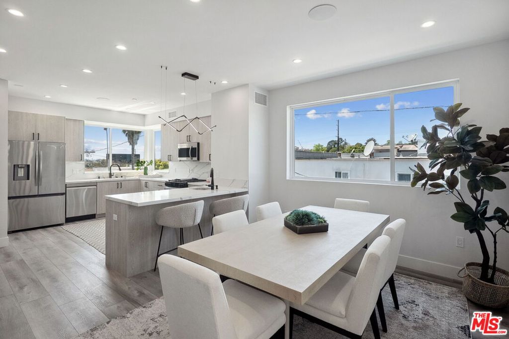 Experience elevated modern living in this newly constructed, architecturally striking 4 bed, 5 bath townhouse in the coveted Crestview neighborhood. Thoughtfully designed with soaring ceilings, oversized windows, and high-end finishes throughout, this home seamlessly blends luxury and functionality. The open-concept layout is anchored by a chef's kitchen featuring marble countertops, a generous center island, stainless steel appliances, and ample cabinetry - ideal for everyday living and entertaining alike. Spacious bedrooms include walk-in closets and spa-inspired baths, while the lavish primary suite offers a serene retreat with dual vanities and a walk-in shower. Additional highlights include a separate upstairs family room, private two-car garage with direct entry, dedicated laundry room, and a sprawling rooftop deck with stunning views - perfect for sunset cocktails or morning coffee. Situated minutes from prime Beverlywood, Beverly Hills, and Culver City, this home is the perfect mix of modern luxury and urban convenience.