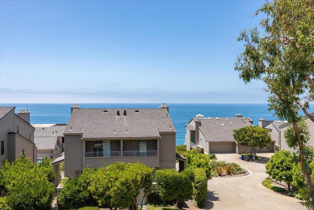 Everything you love about Del Mar! Just one block from the shimmering Pacific Ocean, scenic trails, award-winning restaurants, the iconic Del Mar Race Track, and charming village shops, this stunning 3-bedroom, 2.5-bath townhome offers the ultimate coastal lifestyle with sweeping ocean views. A newly refreshed interior features brand-new luxury vinyl plank flooring, fresh paint throughout, and stylish new lighting that gives the home a clean, modern vibe. The bright kitchen and breakfast nook open to a private patio, ideal for your morning coffee or alfresco dining. The ocean-facing dining and living area, complete with a fireplace, flows seamlessly onto a private balcony where glowing sunsets become your daily backdrop. Upstairs, the ocean-view primary suite boasts its own fireplace, a private balcony, en-suite bath, and brand-new carpet. Two additional bedrooms and a full bath complete the upper level, offering comfort and flexibility for family, guests, or office space. An oversized two-car garage with a large storage area provides ample space for vehicles, beach gear, bikes, boards, and more. Enjoy resort-style amenities as part of the well-maintained HOA, including a sparkling pool, spa, fitness center, tennis courts, and a welcoming clubhouse. Whether you're looking for a full-time residence or a chic beach retreat, this Del Mar townhome delivers the perfect blend of luxury, comfort, and location.