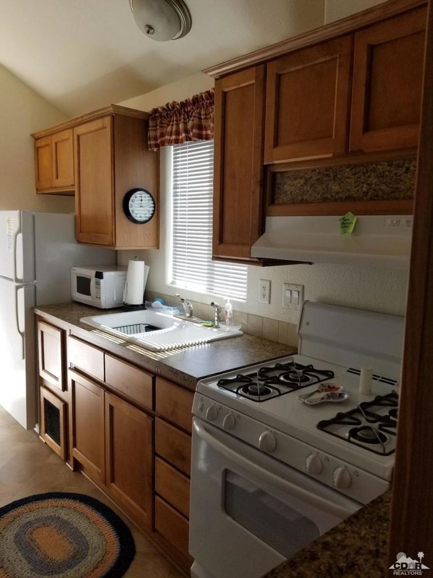 Like new Park Model in desirable Sky Valley Resort. Backs up against the Desert with GORGEOUS mountain Views. This home is spotless, vinyl fencing, shed, deck, mini blinds, laminate and linoleum flooring, pitched high ceilings, furnished, pantry, beautiful counter tops in the kitchen and the bathroom, mirrored wardrobe closet doors. Enjoy the amenities and friendly atmosphere of Sky Valley Resort with geo thermal mineral pools amd spas, ponds, clubhouse, restaraunt,mini store, tennis, pickle ball, racquet ball, basket ball, gym, social activites and much more. This home is like brand new. Must see!