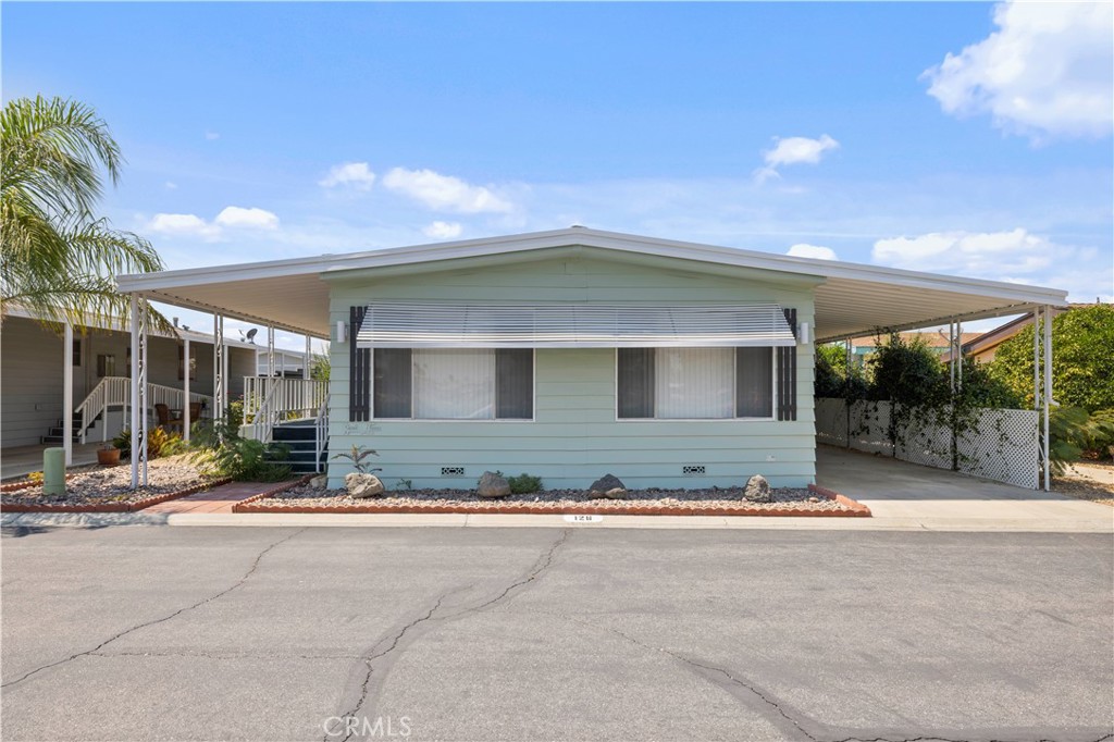 Welcome to your newly remodeled dream home! This stunning 2-bedroom, 2-bath mobile home has been thoughtfully updated with modern touches, offering both style and comfort. From the brand-new kitchen appliances to the sleek quartz countertops and fresh flooring, every detail has been designed with quality in mind. The spacious living room and dining area provide the perfect setting for relaxing or entertaining guests, while the large windows invite natural light to fill the space. Whether you’re enjoying a quiet afternoon or hosting a dinner party, this home is sure to impress.
This home is located in the heart of a beautiful, tranquil, gated community. The location couldn’t be better—directly across from the serene community lake, and just steps away from the clubhouse, where you can enjoy community events, fitness activities, and social gatherings.
Enjoy the peace and quiet of lakeside living while having all the amenities you need within reach. This is the perfect place to embrace a relaxed, low-maintenance lifestyle!
Don’t miss your chance to make this updated mobile home your own—schedule a tour today!