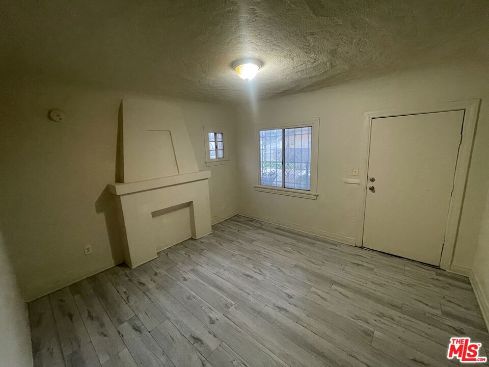 Discover your new home in this beautifully remodeled duplex side unit at 6009 South Halldale Avenue! This charming space features a unique fireplace design, modern laminated flooring, and a fully remodeled kitchen with sleek finishes, perfect for cooking and entertaining. With its bright, airy atmosphere and neutral color palette, this home is ready for you to move in and make it your own. Perfectly suited for a one-year lease, this property combines comfort and convenience in a prime location. Section 8 accepted. Don't miss out on this fantastic opportunity, schedule your tour today!