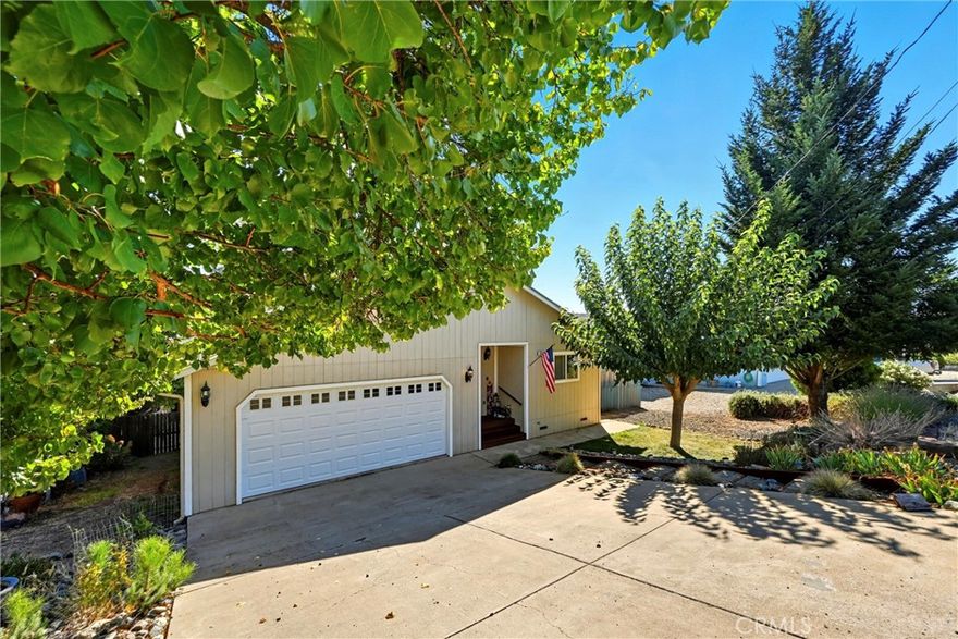Super cute one story home in Kelseyville Riviera, right next to the school! Turn-key 3bed/2bath home built in 2002, with a great layout open floorplan with updated flooring through out, newer modern white kitchen appliances, central heat/AC plus woodstove, efficient whole house fan, & a huge fenced backyard with garden area fenced off, storage shed, paver patio, and low maintenance lawn/landscaping. Good sized bedrooms & closets. Roof is only 4 years old! Attached 2 car garage and extra parking up at the street. Borders the school and only a minute to local shopping center. Move right in! Great option for all loans, FHA, VA or USDA!