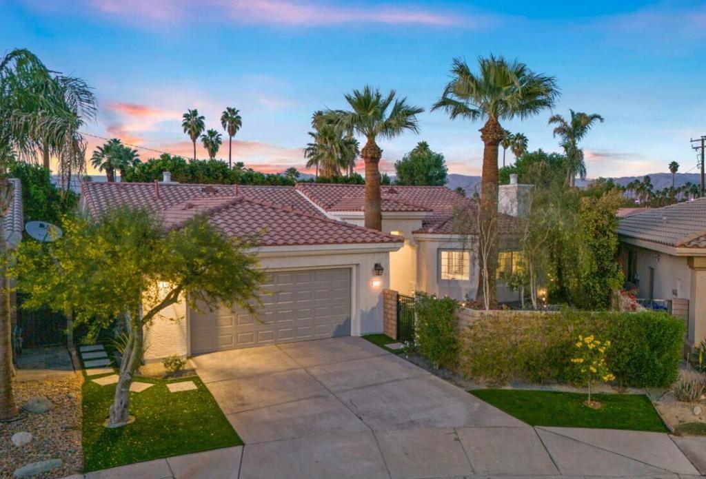 Welcome home to the Grove community where style meets comfort in the heart of Palm Desert! This beautifully remodeled, move-in ready single family home has 3 bedrooms, 3 bathrooms, and over 2,450 square feet of thoughtfully designed living space, perfectly positioned at the end of a quiet cul-de-sac for ultimate privacy. Just minutes from El Paseo, Palm Desert's premier shopping and dining destination, you'll have world-class shopping, restaurants, and entertainment all within reach. Plus, you're ideally located near excellent public, private, and charter schools. Transformed with care and sophistication from brand-new flooring throughout, a modern kitchen featuring quartz countertops and spa-inspired remodeled baths showcasing high-end finishes and designer touches. Entertain with ease in the great room, featuring a custom built-in bar and wine fridge, or unwind in your fully refreshed outdoor spaces with low-maintenance turf, plants and lighting in both the front and rear yards. Additional highlights include all-new lighting fixtures, ceiling fans, a new garage door, and a freshly painted interior and exterior. Come see it today and fall in love with all the details that make this home truly special. *Room for a Pool.
