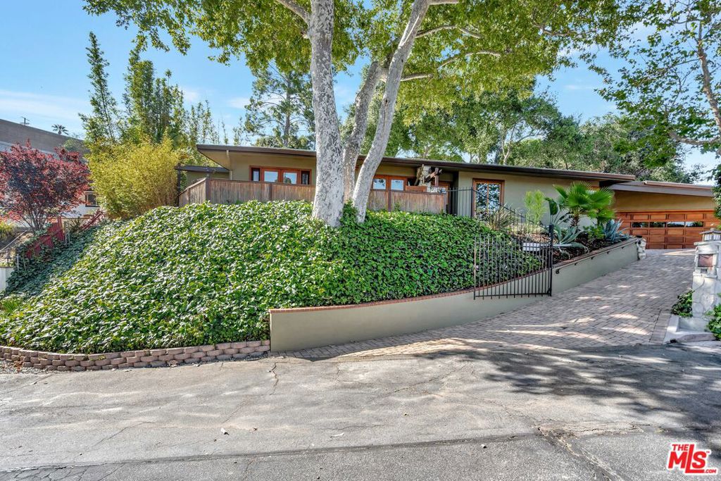 Kape Property Management is pleased to present this truly special single-family home perched at the top of a private, lush cul-de-sac. Located in the Royal Woods neighborhood of Sherman Oaks. Great location for commuters with easy access to the 405 and 101 freeways. Lots of choices for shopping, beauty salons, and dining on Ventura Blvd. and the Sherman Oaks Galleria. This beautiful home consists of 3 bedrooms, 2 bathrooms, a 2-car garage, a bonus room, and a mud room. The home is thoughtfully designed with wonderful attention to detail. Each of the bedrooms is large enough for king-size furniture. The kitchen has plenty of counter space and cabinetry and is equipped with high-end appliances. Plenty of natural lights from the french doors and skylights throughout the property. The living room connects to the backyard, perfect for indoor-outdoor living. The backyard is perfect for entertaining and includes a natural rock waterfall that cascades into a fish pond and a built-in saltwater pool. The hillside provides complete privacy from any neighbors. The owner has taken great care of the property and has upgraded it with a new roof, HVAC equipment, copper plumbing, and high-end appliances. This property will be professionally managed. Pool cleaning and gardening services are included in the rent. This unit will not stay vacant for long so act fast before you miss out on this opportunity.