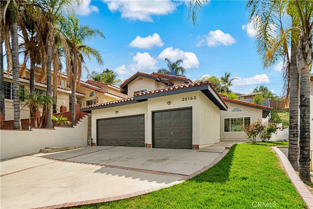 Welcome to 20163 Corona St, a beautifully renovated home in South Corona offering one of the best opportunities for those seeking NO HOA, NO Mello Roos, and a relaxed rural lifestyle without giving up city convenience. The thoughtfully designed layout includes a welcoming living and dining room perfect for entertaining, a spacious kitchen that opens to a cozy family room ideal for gathering, and a main-level bedroom with a full bathroom — perfect for guests or multi-generational living. Upstairs, two guest bedrooms offer nice valley views, while the primary suite boasts direct access to a private back deck. Recent upgrades include brand-new flooring, cabinets, and appliances, fresh interior and exterior paint and updated roof and HVAC systems and more. The nearly 7,000 sq ft lot is easy to maintain yet features self-sustaining fruit trees and a beautiful deck with sweeping valley views, while the hillside setting with a sloped driveway provides extra privacy. Bonus: The home was appraised at $825,000 recently— meaning you’re getting an incredible deal.
