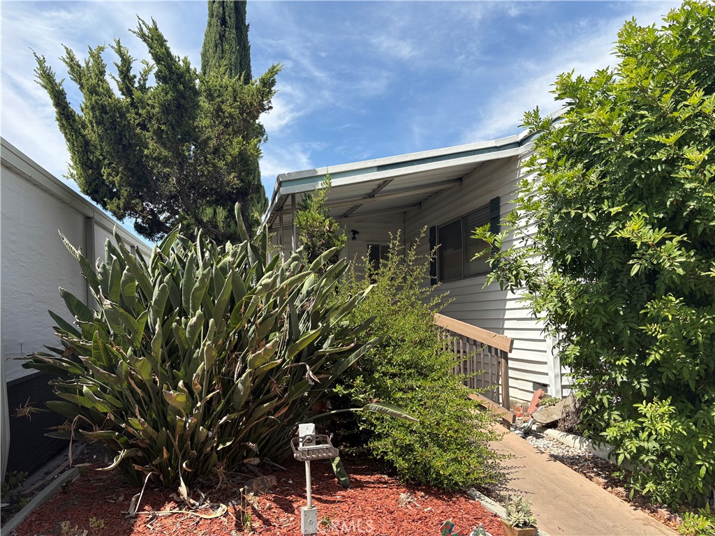Charming Hillside Gem with Breathtaking Views – A Rare Opportunity in Woodland Hills Park Estates! Nestled atop the highly sought-after Woodland Hills Park Estates, this unique and spacious home offers stunning panoramic views that stretch for miles—showcasing the beauty of the city skyline and surrounding landscape. Built in 1963 and still in its original condition, this home is a blank canvas waiting for your personal touch. With some TLC and creative upgrades, you can transform this one-of-a-kind property into your dream retreat. Inside, you’ll find: A generously sized one-bedroom with ample closet space and built-in storage, A full bathroom ready for your modern updates , Original hardwood floors throughout, adding warmth and character, A spacious living room with vaulted ceilings and oversized windows to enjoy the dramatic views. A large entryway that could be easily converted into an extra room , An additional bonus room filled with natural light—perfect for a home office, guest room, or creative studio and Two convenient entryways, one featuring a built-in wheelchair ramp for accessibility. A two-car carport with plenty of room for storage. As a resident of this vibrant community, you’ll enjoy access to a range of resort-style amenities, including: A year-round heated inground pool, A cozy billiard room with two pool tables and a real wood-burning fireplace, A spacious recreation hall—ideal for hosting events and celebrations. Whether you're an investor, a first-time buyer, or someone looking to customize their forever home, this property is a rare find with limitless potential. Bring your vision and make it your own and Hurry as this rare opportunity will not last long !!!