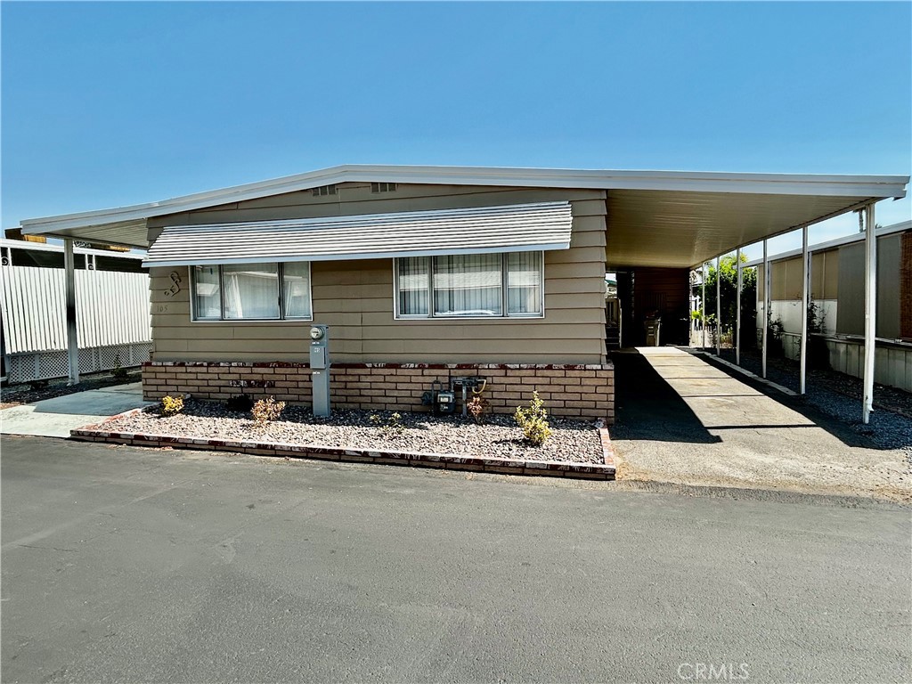 Welcome to this beautifully remodeled 2-bedroom, 2-bath home located in a desirable 55+ community. Step inside to find stunning luxury laminate flooring throughout, creating a modern and elegant feel. The bright and airy kitchen features a spacious island, perfect for entertaining, and opens seamlessly to the living room for comfortable everyday living. Outside, you’ll enjoy the convenience of an attached carport for easy parking. This home is move-in ready and waiting for its new owner—schedule your showing today before it’s gone!