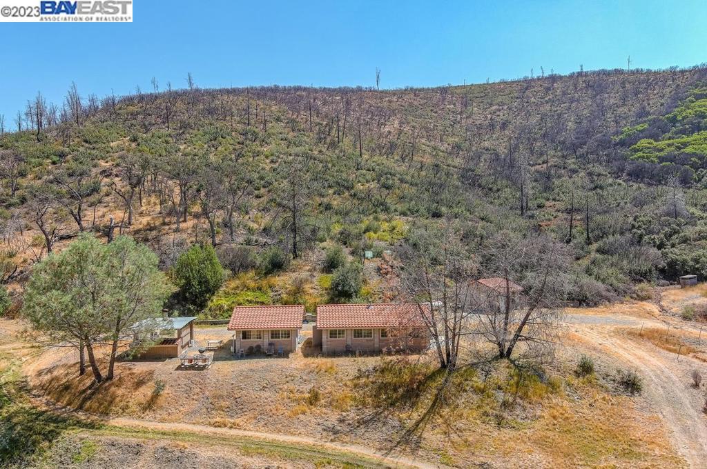 Amazing opportunity to own a little piece of gods country! If you are into hunting, fishing or nature in general, than this 518 acre property is for you! Formerly a private hunting club, this property features a block bunk house with shared kitchen, outdoor BBQ Pit, separate bathroom building with toilets and shower facility, care taker unit, 6.5 miles of fenced area and cross fenced for game containment and stocking, large private pond stocked with bass and cat fish, perfect for hunting and fishing, 16+ streams with ample water all year round, easy access to main building structures accessible by two wheel drive vehicles, dramatic views from ridge tops, the perfect escape from the rest of the world, yet only a 45 minute drive to Tesla Rd. and dynamic Downtown Livermore and the historic wine trail! property has a Livermore address, but is actually located in unincorporated Santa Clara County, May qualify for the Williamson Act tax relief.