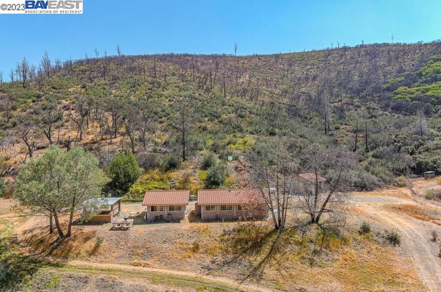 Amazing opportunity to own a little piece of gods country! If you are into hunting, fishing or nature in general, than this 518 acre property is for you!  Formerly a private hunting club, this property features a block bunk house with shared kitchen, outdoor BBQ Pit, separate bathroom building with toilets and shower facility, care taker unit, 6.5 miles of fenced area and cross fenced for game containment and stocking, large private pond stocked with bass and cat fish, perfect for hunting and fishing, 16+ streams with ample water all year round, easy access to main building structures accessible by two wheel drive vehicles, dramatic views from ridge tops, the perfect escape from the rest of the world, yet only a 45 minute drive to Tesla Rd. and dynamic Downtown Livermore and the historic wine trail! property has a Livermore address, but is actually located in unincorporated Santa Clara County,  May qualify for the Williamson Act tax relief.