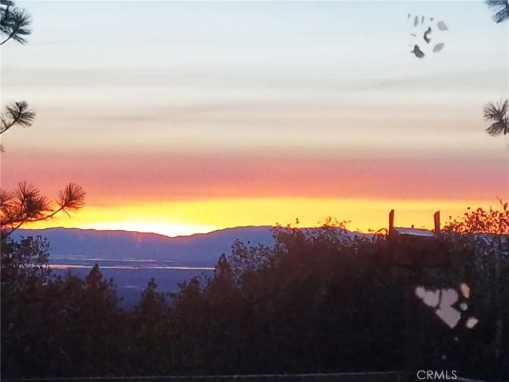 This fabulous 8.14-acre property offers endless potential to build your dream home in one of Northern California’s most peaceful and picturesque settings. Enjoy expansive valley views and colorful sunsets from your own private slice of land, just minutes from downtown Oroville and the recreational paradise of Lake Oroville. The property was previously developed, offering valuable rebuild credits with the county that can help streamline the construction process and reduce costs. While the existing septic and well systems have not been inspected since the Camp Fire, they provide a solid starting point for redevelopment. Electricity is nearby, and prior infrastructure is in place, making this property even more build-ready. Families will appreciate having a K–8 school close by, and Butte Community College is just a 15-minute drive, offering convenient access to higher education and training opportunities. Whether you're looking for a peaceful retreat, an investment property, or a forever home site, this land combines natural beauty with practical advantages. Located in scenic Butte County, often called Northern California’s hidden gem, you’ll be surrounded by outdoor recreation, small-town charm, and a slower pace of life—without sacrificing access to key amenities.