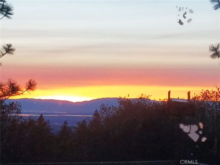 This fabulous 8.14-acre property offers endless potential to build your dream home in one of Northern California’s most peaceful and picturesque settings. Enjoy expansive valley views and colorful sunsets from your own private slice of land, just minutes from downtown Oroville and the recreational paradise of Lake Oroville. The property was previously developed, offering valuable rebuild credits with the county that can help streamline the construction process and reduce costs. While the existing septic and well systems have not been inspected since the Camp Fire, they provide a solid starting point for redevelopment. Electricity is nearby, and prior infrastructure is in place, making this property even more build-ready. Families will appreciate having a K–8 school close by, and Butte Community College is just a 15-minute drive, offering convenient access to higher education and training opportunities. Whether you're looking for a peaceful retreat, an investment property, or a forever home site, this land combines natural beauty with practical advantages. Located in scenic Butte County, often called Northern California’s hidden gem, you’ll be surrounded by outdoor recreation, small-town charm, and a slower pace of life—without sacrificing access to key amenities.