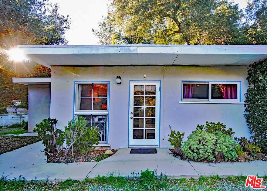 Nestled in the heart of Old Topanga Canyon is this full one-bedroom and one-bath space with a deep closet, back porch, full kitchen, ample yard space, and laundry available. It is the perfect spot for a peaceful environment. The property has a gated entry and is located within easy access to hiking trails, the center of town, SFV, and more, surrounded by majestic mountains and calming sounds of the nearby creek; this is the ideal place to come home to and relax and rejuvenate. With its own parking space and shared visitor parking, this beautiful, quaint spot is ready for you to call your own. Grab your morning libation cup and sit on the picnic bench listening to the creek and birds. Take a long or short morning hike to wake up your day. Sit and read a great book in the comfort of your living room or on the back porch. Just a short distance to the town where you can immerse yourself in the vibrant community, local shops, quaint markets, artisan restaurants, and art galleries, or find that hidden trail and walk for hours listening only to nature. Easy to show end unit of a four plex, quiet community.