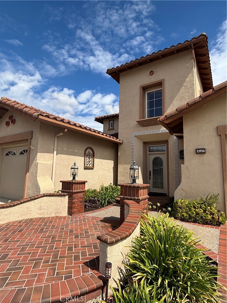 Welcome to this beautiful FIVE bedroom/FOUR bathroom, incredible canyon view home, located on a cul-de-sac in the highly desired guard gated community of Stoneridge. This home features a dramatic foyer, cathedral ceilings, spiral staircase, spacious living and family rooms, cozy fireplaces, gourmet kitchen with freshly painted cabinetry, formal dining room, a downstairs bedroom with full bathroom, large primary suite with balcony, indoor laundry room with utility sink, BRAND NEW carpeting throughout, three car garage with EV plug-in, all on an oversized view lot! With award winning schools, Mission Viejo Lake privileges, a plethora of walking/hiking/biking trails, tennis/pickleball facilities, nearby shops & restaurants, freeway/toll road and beach close, this fantastic home, in the vibrant master planned city of Mission Viejo, is sure to be snatched up quickly.