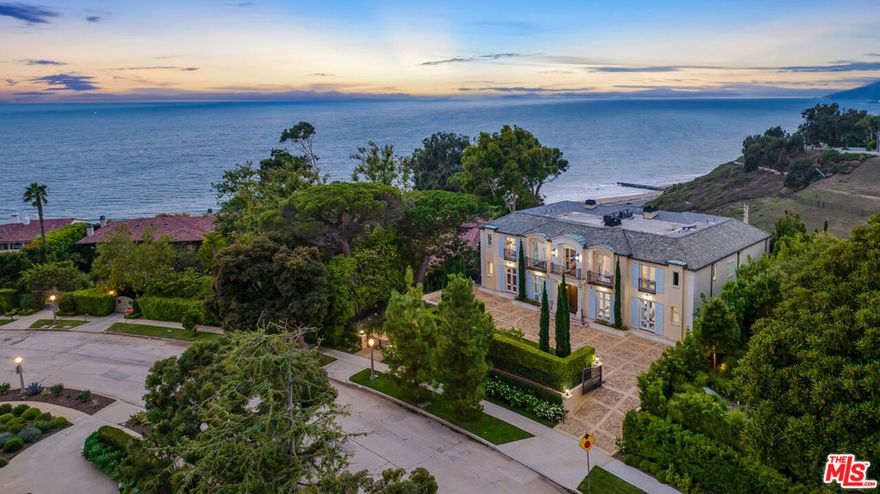 Newly constructed European inspired Pacific Palisades Estate, prominently positioned on the Huntington Palisades bluffs with ocean vistas, and glorious sunset views. Meticulously crafted in 2019, with elegant design and top of the line finishes throughout. The impressive 9,000SF+/- 6 bed, 8 bath home boasts a statement entry with 25' ceilings, grand staircase and views out to the sprawling, private lawns with pool, spa and micro-orchid and vineyard. Walnut floors adorn the two-story residence, with an entertainer's kitchen, intimate wine and billiards room, library, elevator and generous 10-vehicle garage. Second master suite on main level that opens to the lush, landscaped grounds. Located in one of the most desirable areas of the Pacific Palisades, moments to beaches, parks, hiking trails, the Palisades Village with shopping and dining and top-tier schools. The home beautifully embraces the California coastal lifestyle.