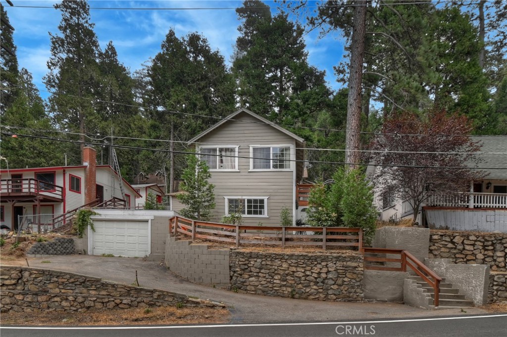 Welcome to your Crestline retreat, perfectly positioned on a well-traveled main road that puts everything you need within easy reach and is a easy commuter location. This cozy 3-bedroom, 2-bath home offers comfortable living, plus a handy garage. Its tucked in a friendly neighborhood and just minutes away from shops, dining, parks, and many more outdoor activity's.
This home has a new stove and washer/dryer and the kitchen has wood like tile flooring.
In the spacious living area there is a beautiful real rock fire place.
This is the perfect blend of mountain charm.