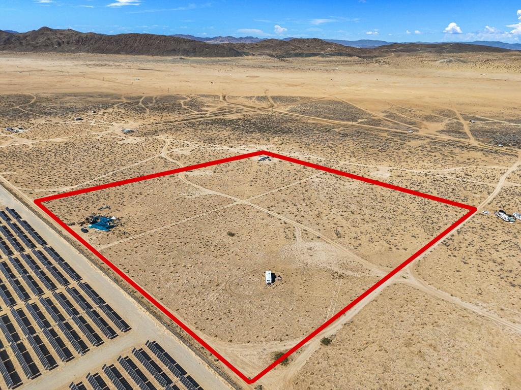 Discover a stunning 10-acre private oasis at 0 Sun Mesa Road in Joshua Tree, CA, near Bureau of Land Management property and a popular camping area. Enjoy breathtaking views of Copper Mountain, Mt. Nebo, the Little San Bernardino Mountains, and the snow-capped peaks of Mt. San Gorgonio, with starry nights enhancing the serene atmosphere. This parcel offers power close by and is ready for your hoses and animals. Although there is no existing water supply, you can drill a well to create your private luxury oasis compound. Close to Joshua Tree Lake Bed, ideal for off-roading and hiking adventures. Located in a highly sought-after vacation rental area, this property is approximately 12 miles from Joshua Tree National Monument park gates. The thriving short-term rental market in Joshua Tree offers excellent investment potential, with appreciation from the land and cash flow from rentals. Explore opportunities with the county for subdividing, building multiple homes, or considering agricultural or solar farm ventures. Contact the local water district and well companies for water information and consult your contractor for electrical needs. Don't miss this exceptional opportunity to own a piece of Joshua Tree's natural beauty and thriving community!