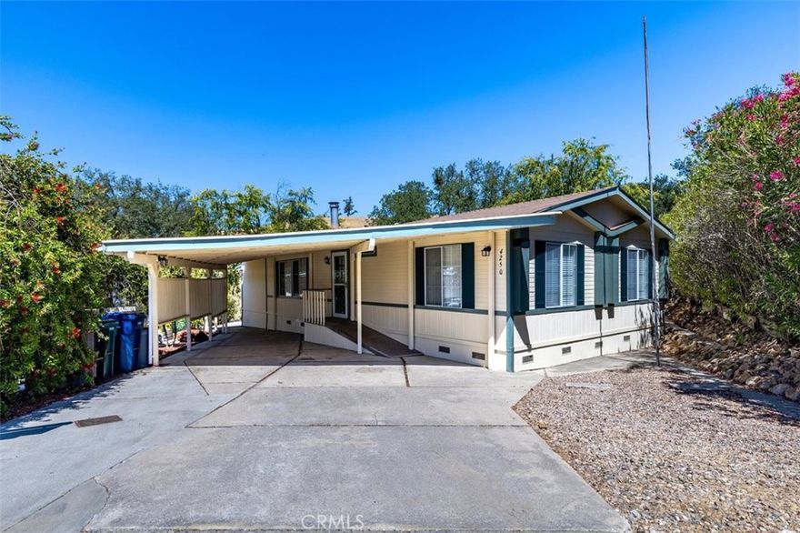 Live the Lake Life in Heritage Ranch at Lake Nacimiento! This beautifully updated and maintained 3-bedroom, 2-bathroom home is located on a quiet cul-de-sac, backing to a greenbelt for added privacy and scenic views. Freshly painted inside and out, this move-in ready home features vaulted ceilings, slate tile entry, high baseboards, and quality finishes that reflect exceptional attention to detail. The spacious living room includes a cozy pellet stove—perfect for chilly evenings. 
The fully remodeled kitchen boasts custom Alder cabinets with large pullouts, granite countertops, and an adjacent dining area. The private master suite, which includes jack and jill closets and an ensuite bath. Skylights throughout bring in abundant natural light. Two additional bedrooms, a second full bath, and a bonus game room provide ample space for family or guests.
Enjoy the wildlife, peaceful surroundings and stunning views from the expansive covered back deck. A large carport offers plenty of room for boats, RVs, or lake toys.
Qualifies for conventional financing. Heritage Ranch amenities include: private launch ramp, 24-hour guarded gate, 2 pools, pickleball/sports courts, hiking & biking trails, private docks, equestrian center, senior center, rec barn, golf range, guest camping, baseball field, and multiple playgrounds. Low HOA dues – only $180 month.
Conveniently located right out of the gates is Cappy Culver School, Oak Hill Market, Captain’s Cove & Lake life restaurants, gas station, car wash, and just a short drive to town, wineries and beaches. Rural living with the conveniences of the big city! The best of Paso Robles!