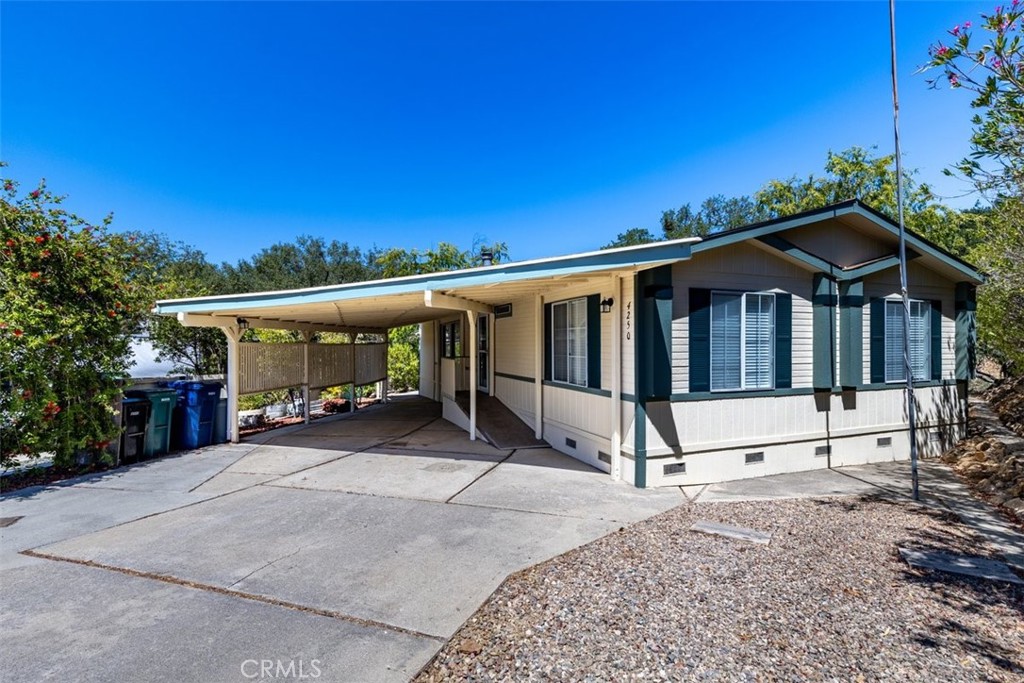 Live the Lake Life in Heritage Ranch at Lake Nacimiento! This beautifully updated and maintained 3-bedroom, 2-bathroom home is located on a quiet cul-de-sac, backing to a greenbelt for added privacy and scenic views. Freshly painted inside and out, this move-in ready home features vaulted ceilings, slate tile entry, high baseboards, and quality finishes that reflect exceptional attention to detail. The spacious living room includes a cozy pellet stove—perfect for chilly evenings.
The fully remodeled kitchen boasts custom Alder cabinets with large pullouts, granite countertops, and an adjacent dining area. A sliding barn door leads to the private master suite, which includes jack and jill closets and an ensuite bath. Skylights throughout bring in abundant natural light. Two additional bedrooms, a second full bath, and a bonus game room provide ample space for family or guests.
Enjoy the wildlife, peaceful surroundings and stunning views from the expansive covered back deck. A large carport offers plenty of room for boats, RVs, or lake toys.
Heritage Ranch amenities include: private launch ramp, 24-hour guarded gate, 2 pools, pickleball/sports courts, hiking & biking trails, private docks, equestrian center, senior center, rec barn, golf range, guest camping, baseball field, and multiple playgrounds. Low HOA dues – only $180 month.
Conveniently located right out of the gates is Cappy Culver School, Oak Hill Market, Captain’s Cove & Lake life restaurants, gas station, car wash, and just a short drive to town, wineries and beaches. Rural living with the conveniences of the big city!