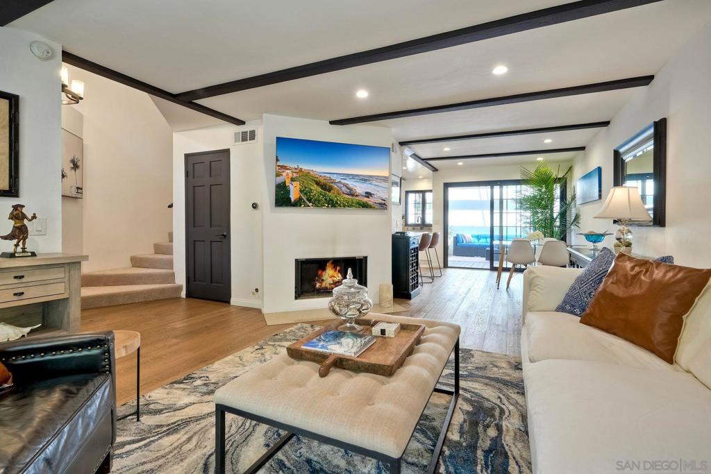 Assumable 30-year fixed VA loan at 2.625% available to qualified buyer, veteran or not! Welcome to this beautifully remodeled townhome in the coveted Villas Mallorca community—where style, privacy, and convenience converge in the heart of La Jolla. This 2-bedroom, 2.5-bath residence offers 1,358 square feet of thoughtfully designed living space with no neighbors above or below. Step inside to discover soaring vaulted ceilings with exposed wood beams, custom interior paint, and a cozy fireplace that anchors the living room. The chef’s kitchen features quartz countertops, upgraded cabinetry with extra storage, and stainless steel appliances. Enjoy indoor/outdoor living with three private balconies accessed by elegant French doors. The oversized guest bedroom includes a generous closet, while the luxurious primary suite boasts dual closets, dual sinks, vaulted ceilings, and its own balcony retreat. Additional upgrades include a Nest thermostat, state-of-the-art security system, in-unit laundry, and an oversized 2-car attached garage with built-in storage. Residents enjoy access to resort-style amenities including a pool, spa, and two newly renovated lighted tennis courts—all surrounded by lush, tree-lined landscaping. Just a short stroll to La Jolla Village Square (0.1 miles) and minutes from UC San Diego, Westfield UTC, beaches, and top dining and retail destinations, this home offers unparalleled access to everything La Jolla has to offer. Easy freeway access makes commuting a breeze. This is the best of coastal living, right where you want to be. Assumable 30-year fixed VA loan at 2.625% available to qualified buyer, veteran or not! Welcome to this beautifully remodeled townhome in the coveted Villas Mallorca community—where style, privacy, and convenience converge in the heart of La Jolla. This 2-bedroom, 2.5-bath residence offers 1,358 square feet of thoughtfully designed living space with no neighbors above or below. Step inside to discover soaring vaulted ceilings with exposed wood beams, custom interior paint, and a cozy fireplace that anchors the living room. The chef’s kitchen features quartz countertops, upgraded cabinetry with extra storage, and stainless steel appliances. Enjoy indoor/outdoor living with three private balconies accessed by elegant French doors. The oversized guest bedroom includes a generous closet, while the luxurious primary suite boasts dual closets, dual sinks, vaulted ceilings, and its own balcony retreat. Additional upgrades include a Nest thermostat, state-of-the-art security system, in-unit laundry, and an oversized 2-car attached garage with built-in storage. Residents enjoy access to resort-style amenities including a pool, spa, and two newly renovated lighted tennis courts—all surrounded by lush, tree-lined landscaping. Just a short stroll to La Jolla Village Square (0.1 miles) and minutes from UC San Diego, Westfield UTC, beaches, and top dining and retail destinations, this home offers unparalleled access to everything La Jolla has to offer. Easy freeway access makes commuting a breeze. This is the best of coastal living, right where you want to be.