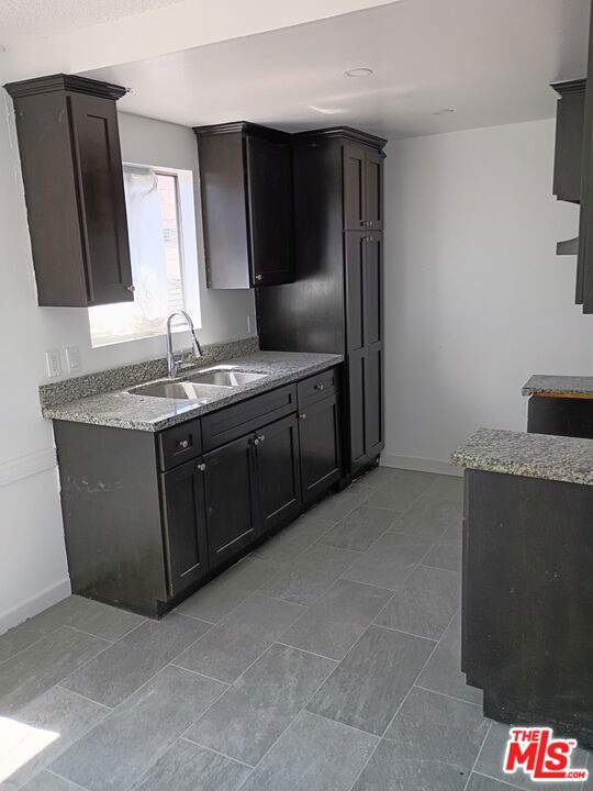 Freshly remodeled three bedroom one bathroom unit with two gated parking spaces.